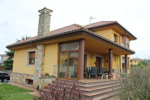 Fachada principal y lateral   :Vivienda-Unifamiliar 
