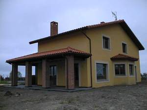 Fachada principal y lateral 2  :Vivienda-Unifamilar 