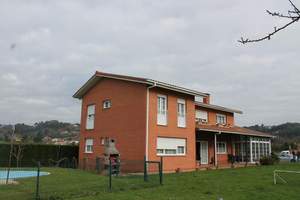 Fachada  principal y  lateral :Vivienda-Unifamilar 